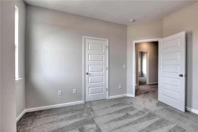 unfurnished bedroom with light carpet