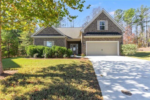 view of front of property with a front lawn and a garage