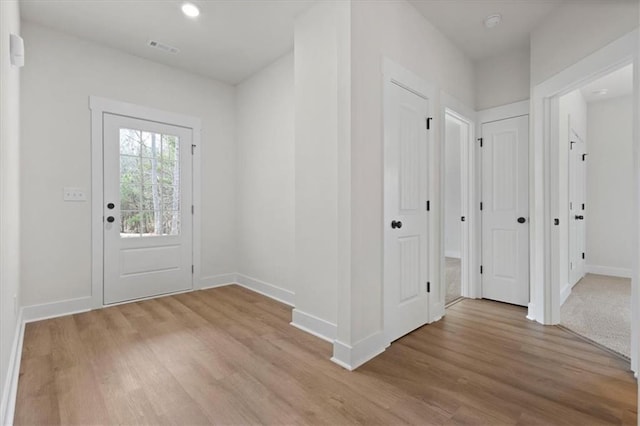 entrance foyer with recessed lighting, visible vents, baseboards, and light wood-style flooring