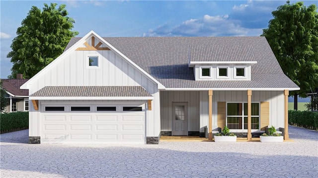 modern farmhouse style home with covered porch, board and batten siding, driveway, and a garage