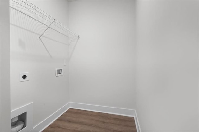 laundry area with laundry area, hookup for a washing machine, baseboards, and dark wood-type flooring