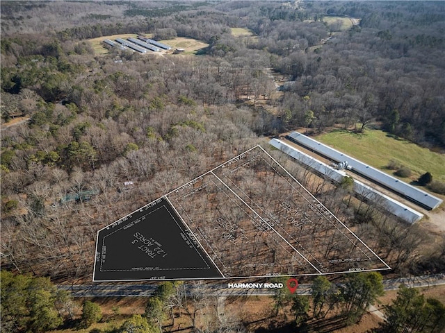 aerial view featuring a wooded view