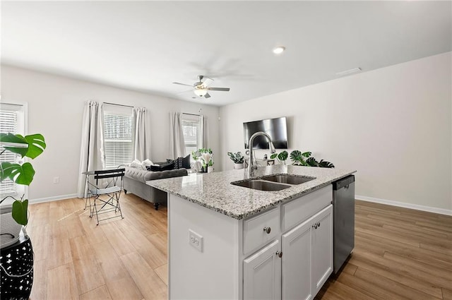 6372 Rosetta Dr SW, Atlanta, GA 30331 - kitchen featuring a sink, stainless steel dishwasher, ceiling fan, open floor plan, and light wood-style flooring