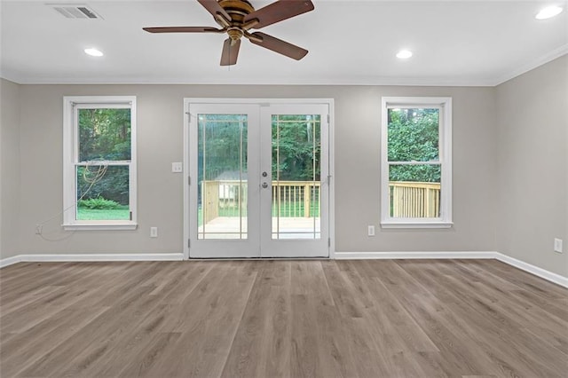 entryway with ceiling fan, wood-type flooring, french doors, and plenty of natural light