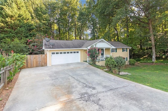 single story home featuring a front yard and a garage