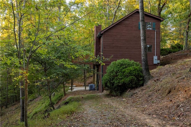 view of home's exterior with central AC