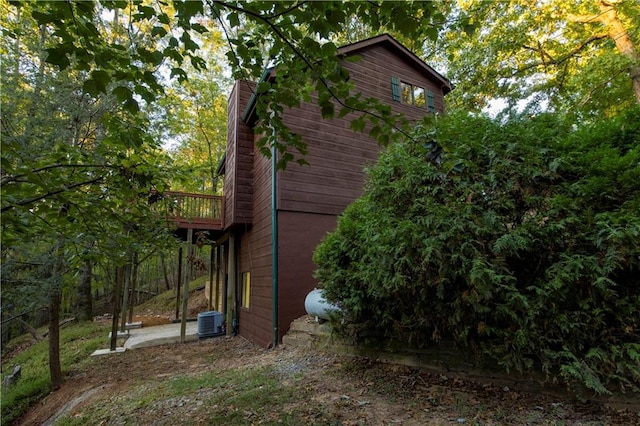 view of side of property with central AC unit