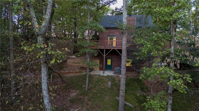 596 Riverview Dr, Ellijay, GA 30540 - back of property with a shingled roof, a chimney, and central air condition unit