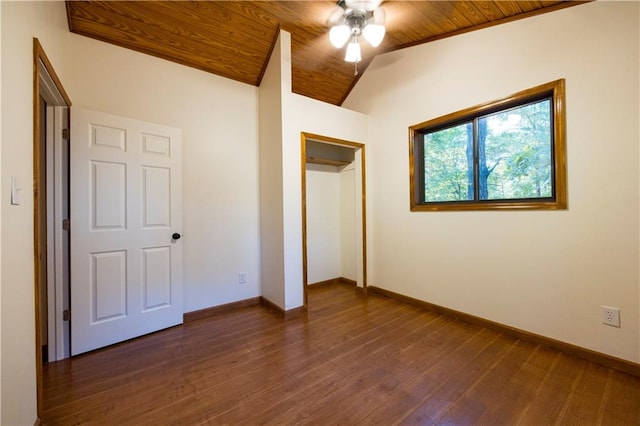 unfurnished bedroom featuring dark hardwood / wood-style flooring, vaulted ceiling, ceiling fan, and wooden ceiling