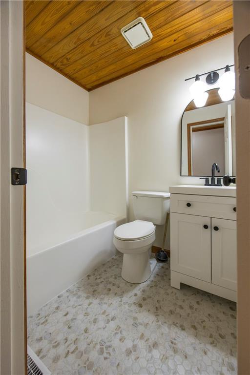 596 Riverview Dr, Ellijay, GA 30540 - bathroom with wooden ceiling, toilet, vanity, and tile patterned floors