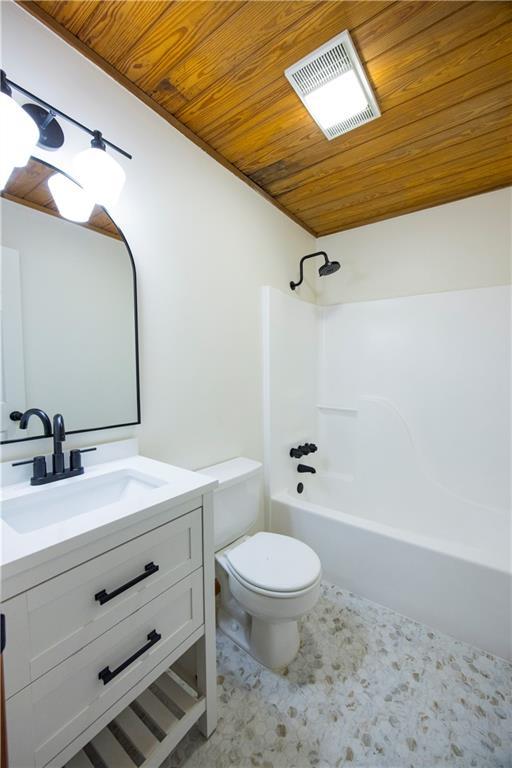 596 Riverview Dr, Ellijay, GA 30540 - bathroom with wooden ceiling, toilet, vanity, and shower / washtub combination