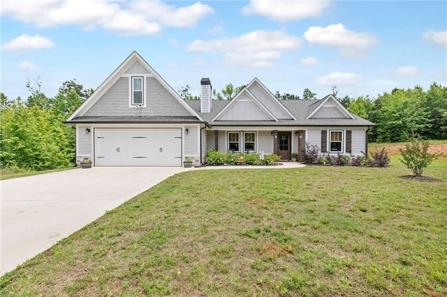 2241 N 16th Hwy, Whitesburg, GA 30185 - view of front of house featuring driveway, a garage, a front lawn, and a chimney