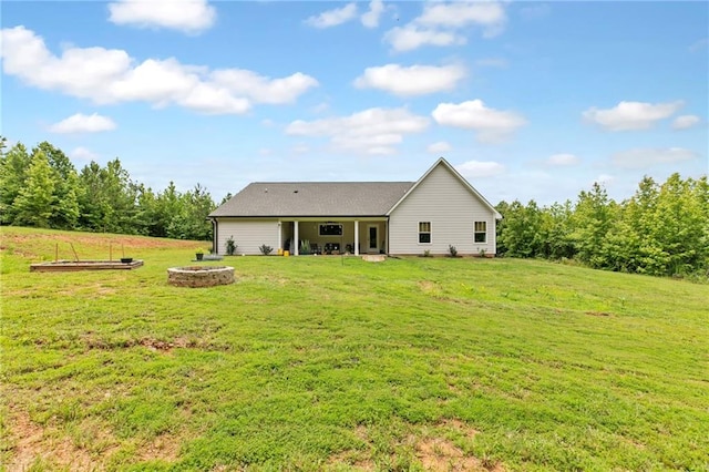 2241 N 16th Hwy, Whitesburg, GA 30185 - rear view of house with a lawn and a fire pit