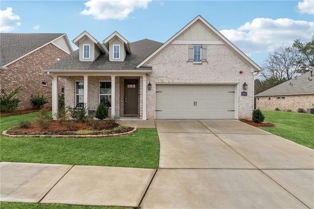 view of front of home featuring a front lawn and a garage