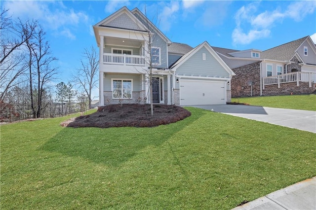 view of front of property featuring concrete driveway, an attached garage, a front yard, a balcony, and stone siding