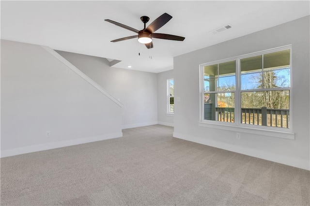 unfurnished room with recessed lighting, light carpet, a ceiling fan, visible vents, and baseboards