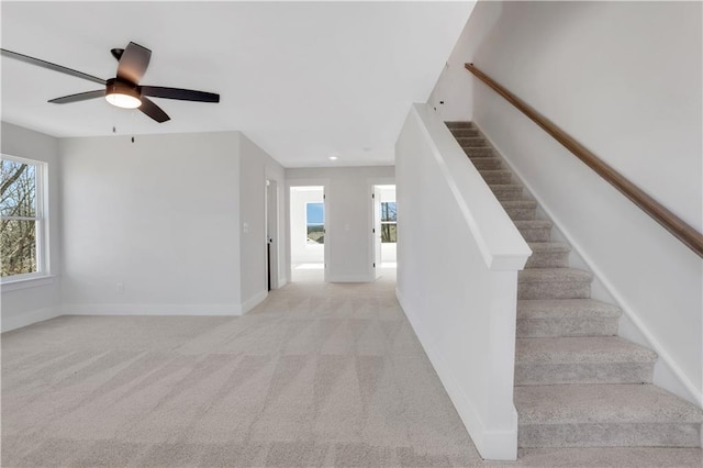 staircase featuring carpet floors, recessed lighting, a ceiling fan, and baseboards