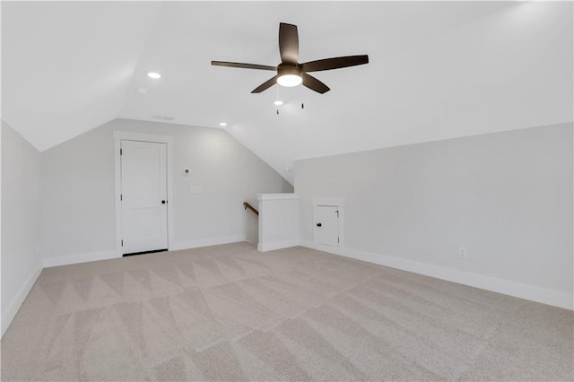 bonus room featuring lofted ceiling, recessed lighting, baseboards, and light colored carpet