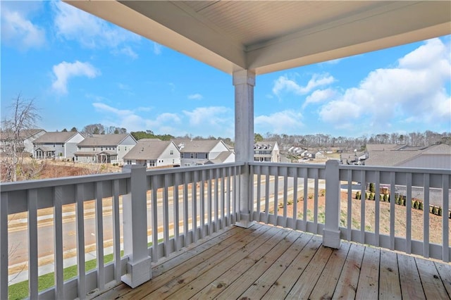 wooden deck featuring a residential view