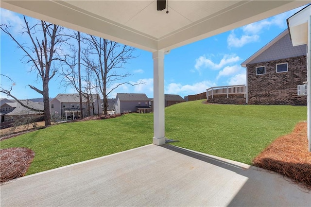 view of yard with a patio area and a residential view