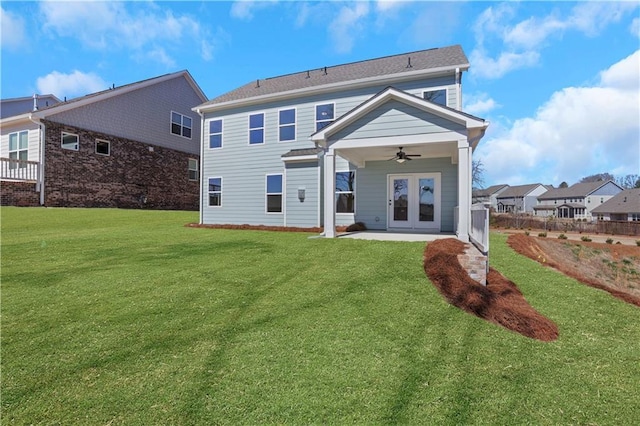 back of property featuring ceiling fan, a yard, french doors, and a patio area