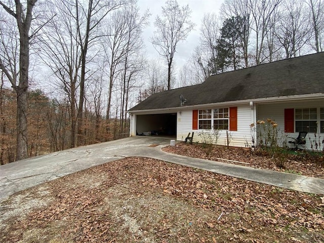 exterior space with a carport and a garage