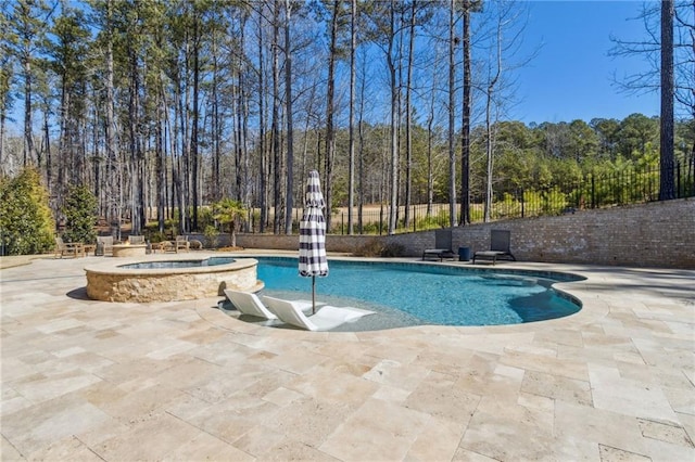 view of pool with a patio, an in ground hot tub, and a fenced in pool