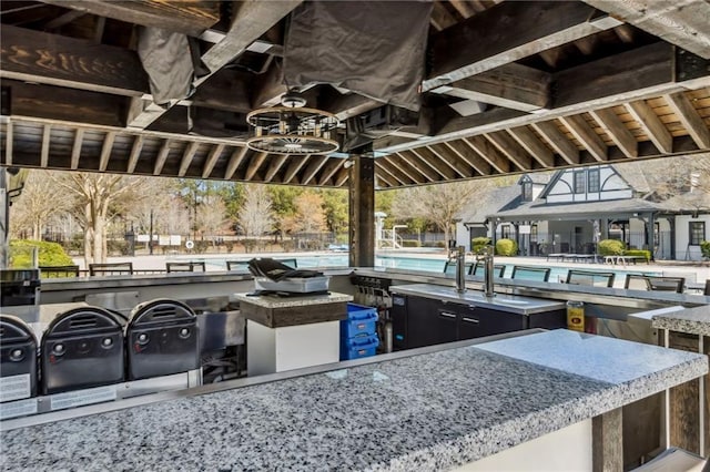view of patio / terrace featuring area for grilling and a community pool