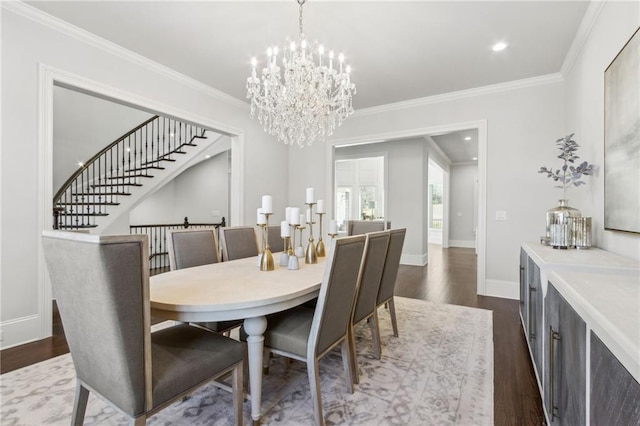 dining area with baseboards, a notable chandelier, ornamental molding, and dark wood finished floors