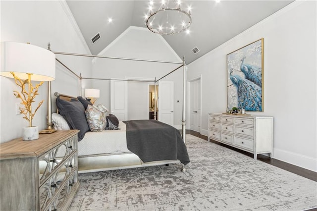 bedroom with wood finished floors, high vaulted ceiling, visible vents, an inviting chandelier, and crown molding