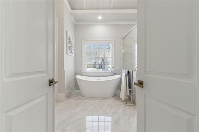 full bathroom with a shower, marble finish floor, a soaking tub, and crown molding