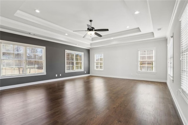 interior space featuring a ceiling fan, a raised ceiling, crown molding, and dark wood-style flooring
