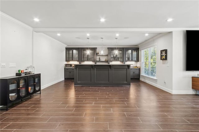 interior space featuring dark wood finished floors, baseboards, ornamental molding, and recessed lighting