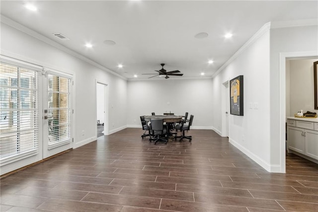 dining area featuring crown molding, dark wood finished floors, visible vents, and ceiling fan