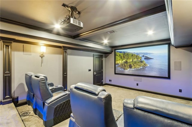 carpeted home theater room with ornamental molding, baseboards, and visible vents