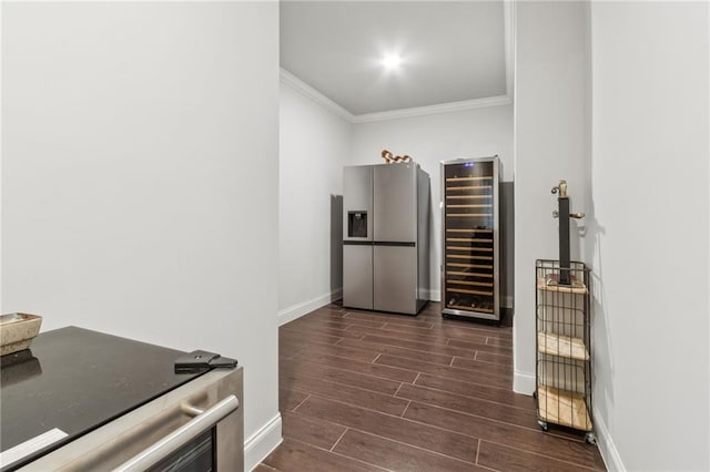 4434 Oglethorpe Loop NW, Acworth, GA 30101 - kitchen with beverage cooler, baseboards, ornamental molding, stainless steel fridge, and dark wood-type flooring