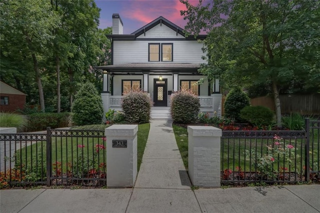 view of front of property featuring covered porch