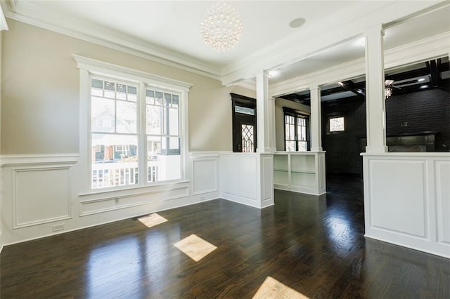 interior space with a premium fireplace, brick wall, ceiling fan, and dark hardwood / wood-style flooring