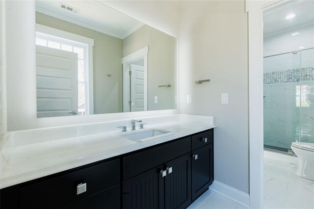 bathroom featuring vanity, toilet, and a shower with shower door