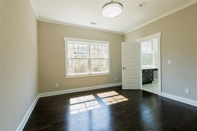 hallway with ornamental molding and dark wood-type flooring