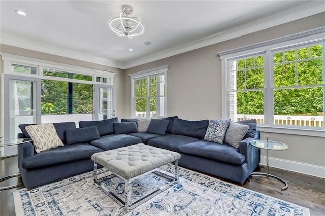 unfurnished living room with ornamental molding, dark hardwood / wood-style floors, and a notable chandelier