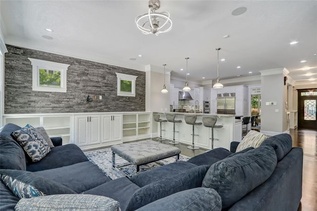 living room featuring ornamental molding, hardwood / wood-style flooring, and plenty of natural light