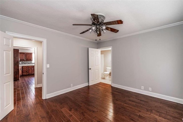 spare room with ceiling fan, a textured ceiling, ornamental molding, and dark hardwood / wood-style flooring