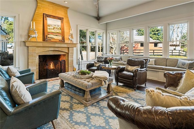 living area with wood finished floors and a high end fireplace