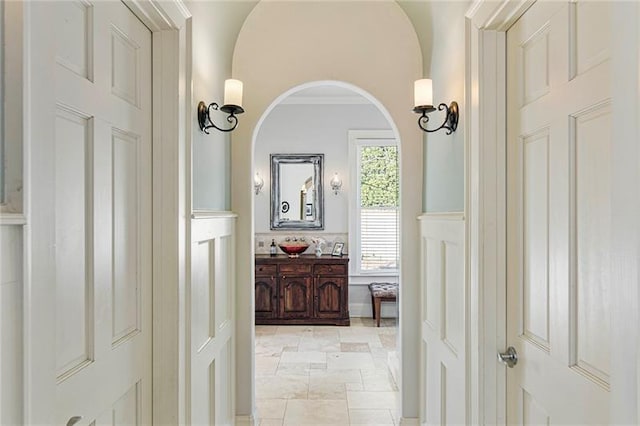 hallway featuring arched walkways