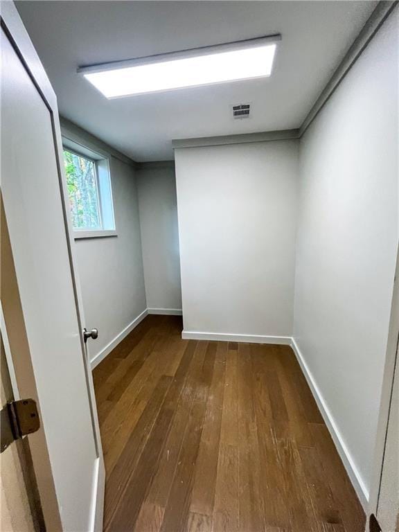 unfurnished room featuring dark wood-type flooring