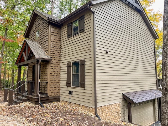 view of side of property with a garage