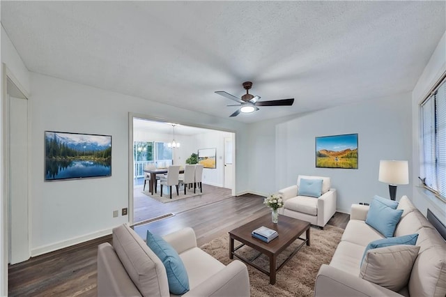 living room featuring dark wood finished floors and a textured ceiling