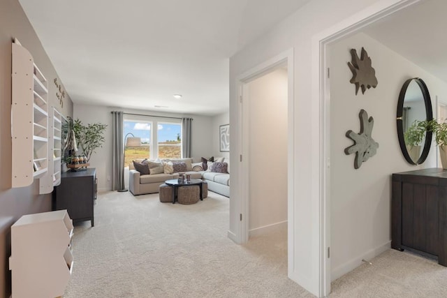 interior space featuring carpet and baseboards