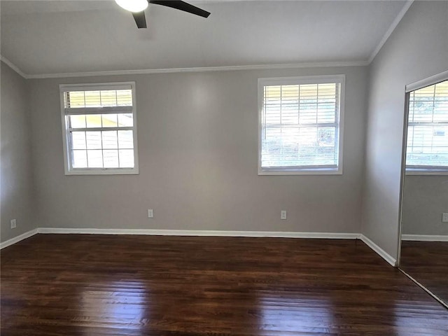 empty room featuring ceiling fan, baseboards, wood finished floors, and ornamental molding